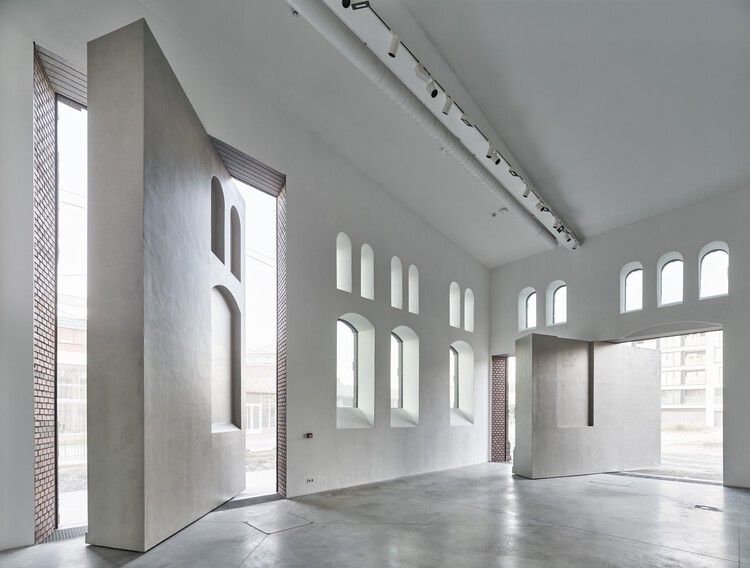 Modern exhibition hall in a Swiss art and culture space with high ceilings.